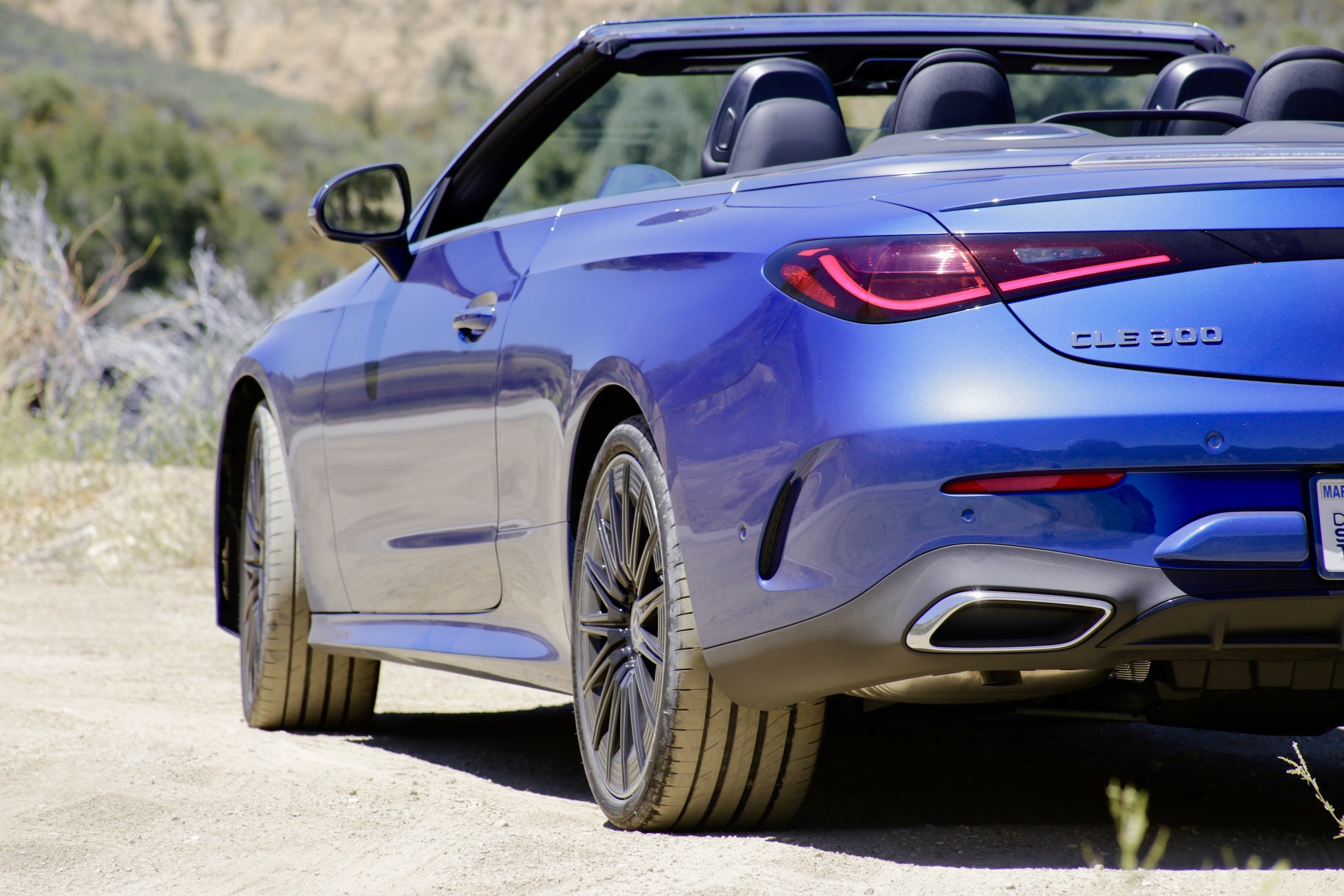 Close-up of the 2024 Mercedes-Benz CLE300 Cabriolet front grille and Mercedes-Benz emblem.