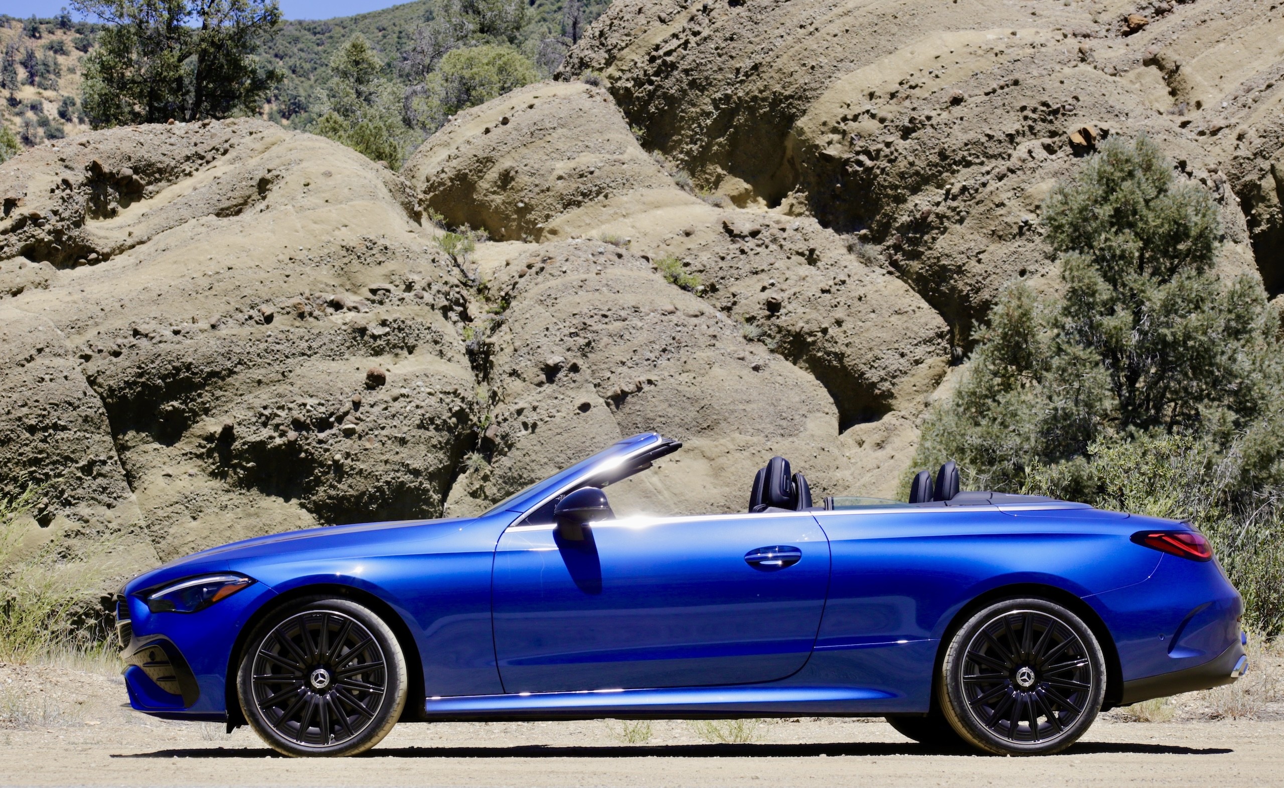 Close-up of the 2024 Mercedes-Benz CLE300 Cabriolet wheel and fender, showcasing the AMG wheel design and sporty stance.