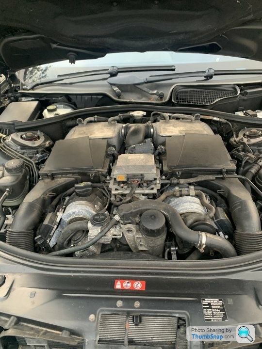 engine bay of a mercedes s600 w221, showing the v12 engine