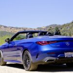 Front three quarter view of the 2024 Mercedes-Benz CLE300 Cabriolet showing its sleek lines and open top.