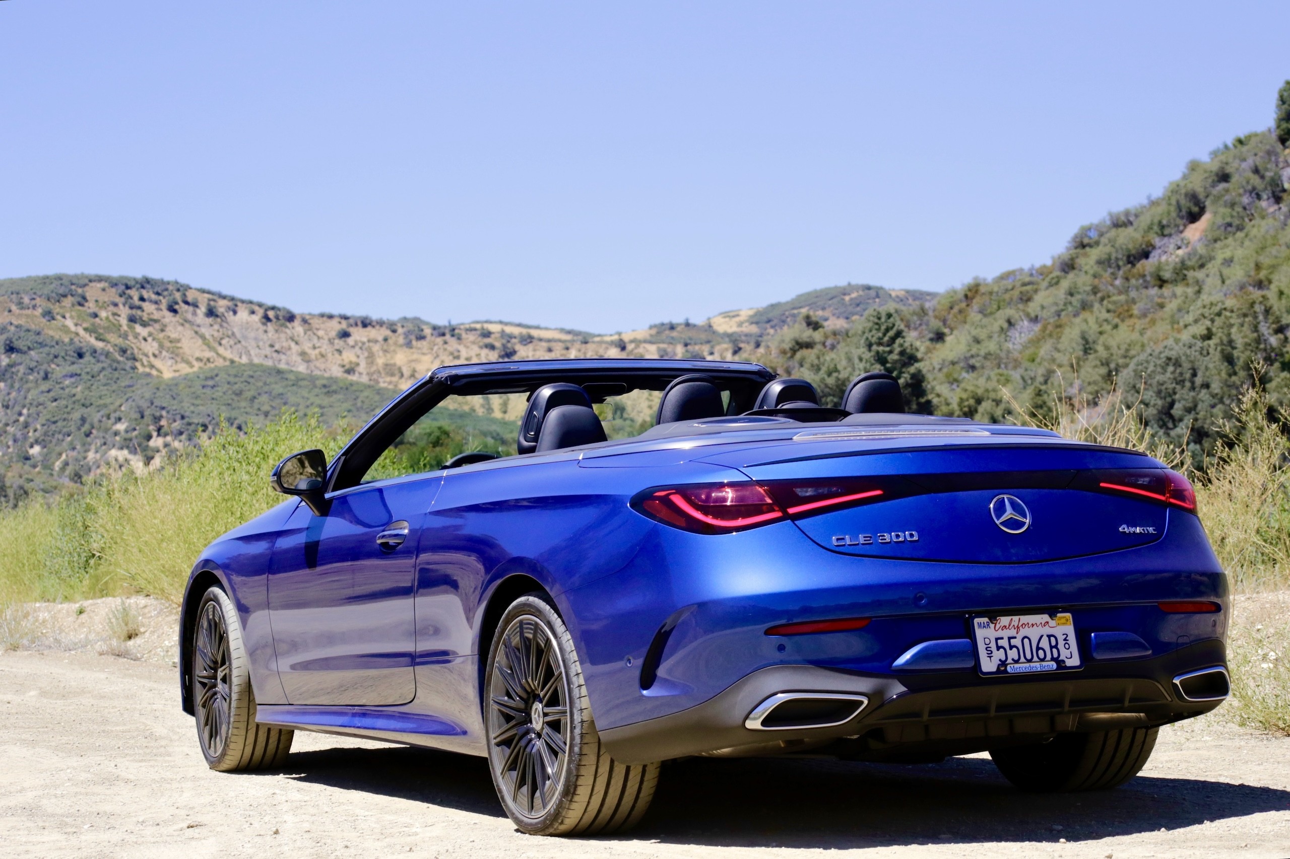 Front three quarter view of the 2024 Mercedes-Benz CLE300 Cabriolet showing its sleek lines and open top.