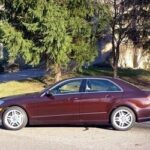 Front view of a 2013 Mercedes Benz E550 4Matic, showcasing its sharp lines and traditional sedan design