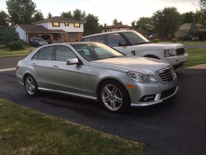 Front view of Mercedes W212 before ride height adjustment, showing excessive wheel gap