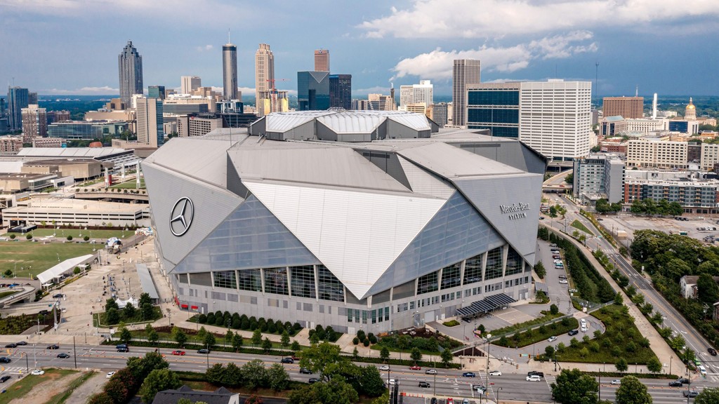 Interior view of Mercedes-Benz Stadium in Atlanta, Georgia, showcasing its expansive seating and retractable roof, home of the Atlanta Falcons and Atlanta United FC. Discover the stadium's capacity for NFL, MLS, and major events.