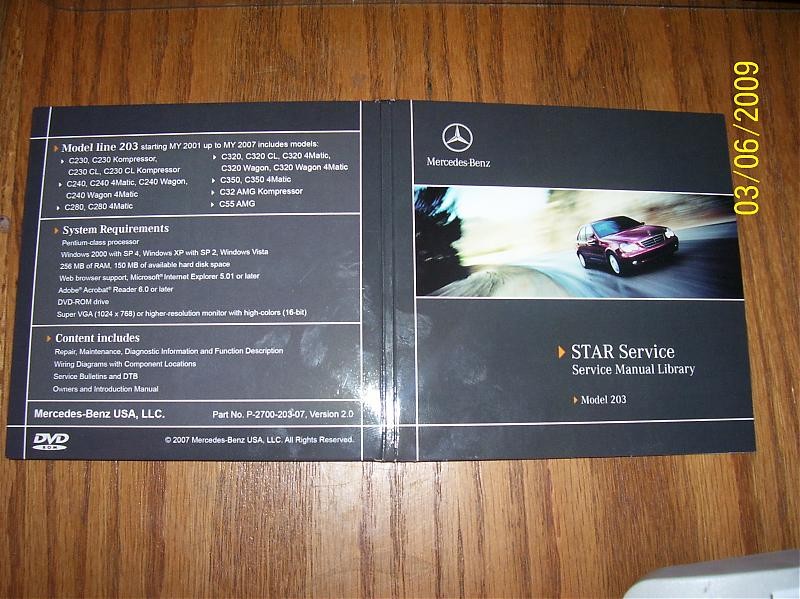 Mercedes-Benz Star Service DVD P-2700-203-07 for W203 models, a valuable resource for older Mercedes diagnostics and repair information, showing an alternative interface to Xentry open port systems for vehicle data access.