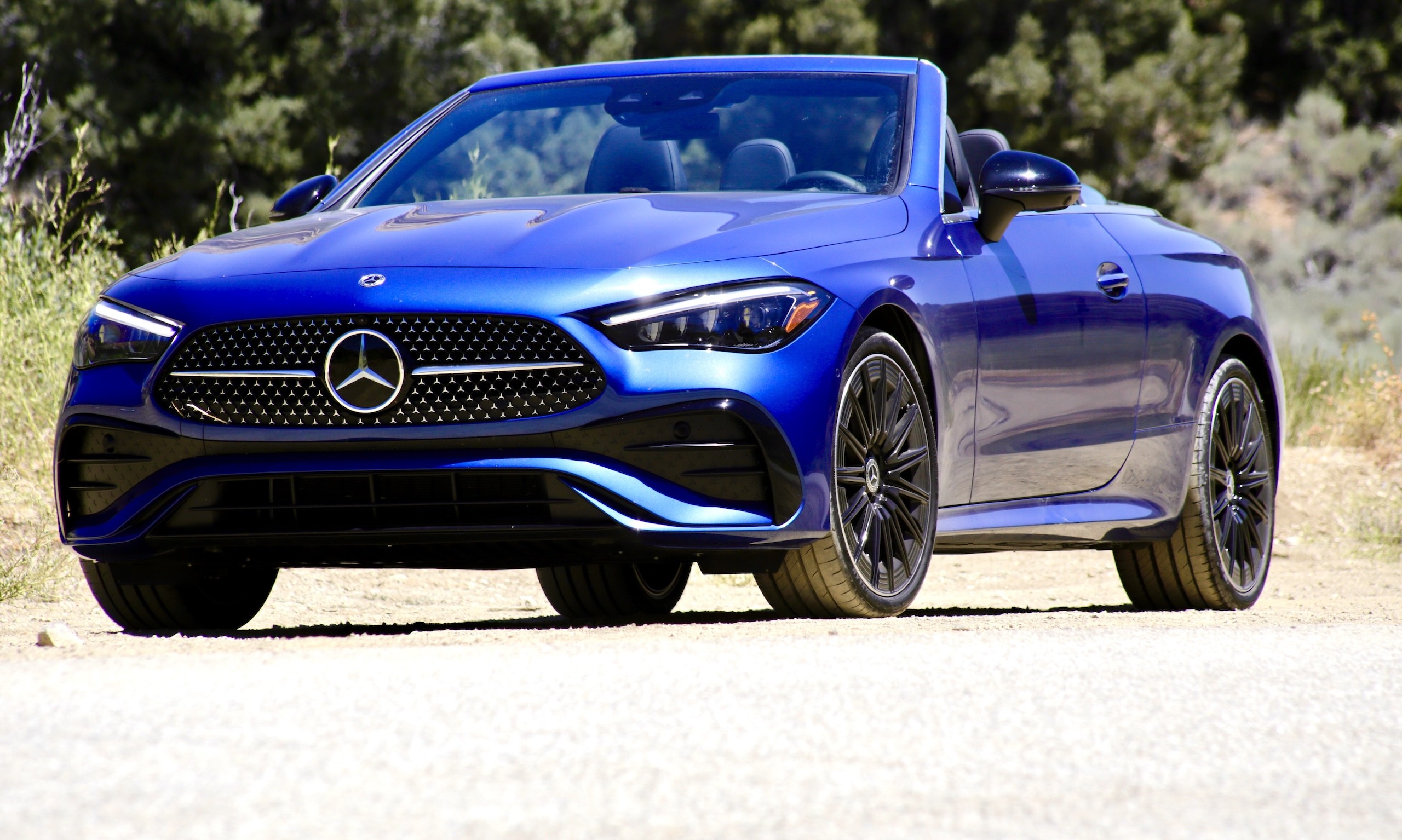 Rear view of the 2024 Mercedes-Benz CLE300 Cabriolet showcasing its taillights and quad exhaust outlets.